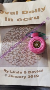 Oval Doily in Ecru (Linda Davies) about to be made in Fuchsia thread by Onemadtatter
